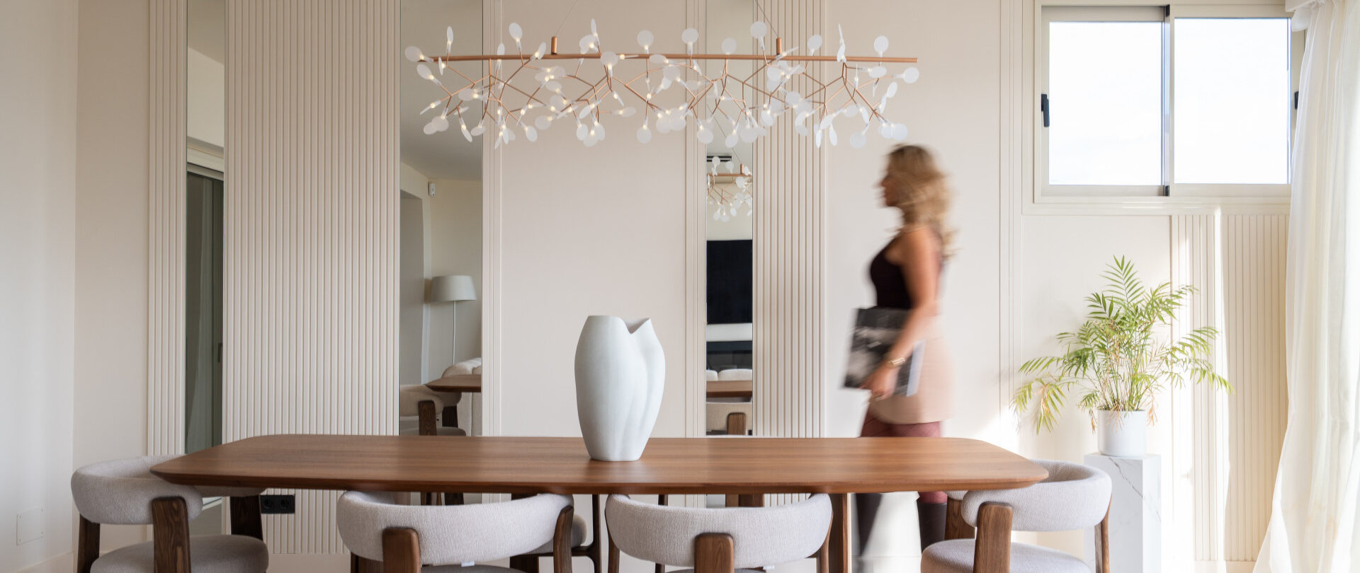 Property agent walking through a modern apartment in Marbella